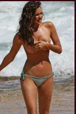 Imagem Irina Shayk mostra os peitos em ensaio, mas é flagrada por paparazzo. Veja