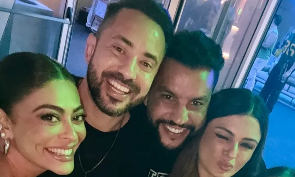 Foto de Éverton Ribeiro com a esposa e a atriz global Juliana Paes no Rock in Rio 2024